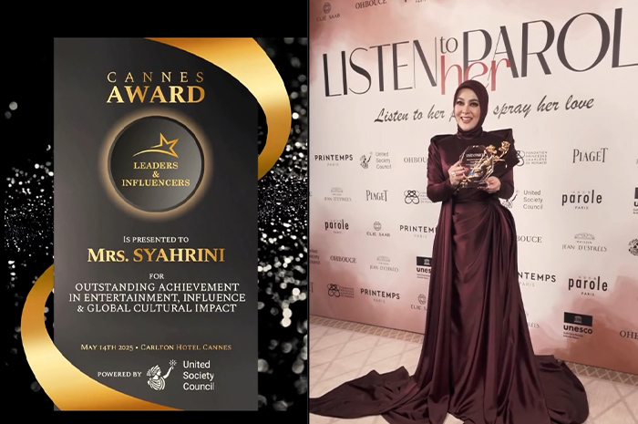Syahrini dengan piala plagat ditangannya dan poster penghargaan Cannes.