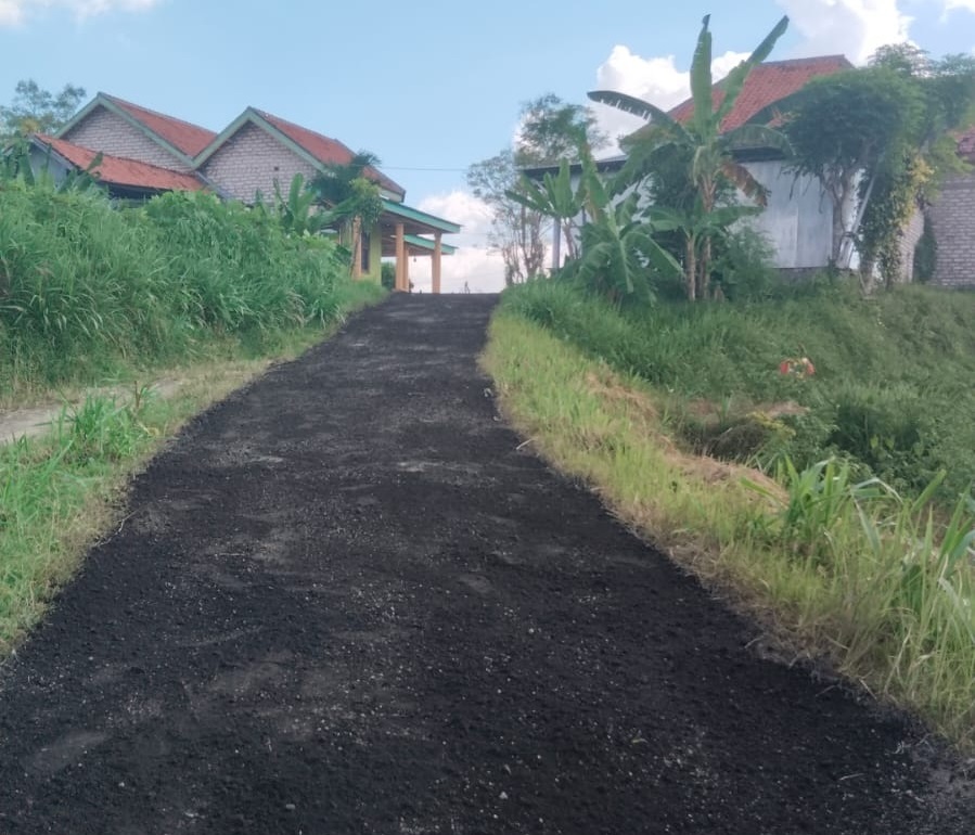 MULUS: Kondisi jalan yang sudah diaspal di Dusun Kopok.