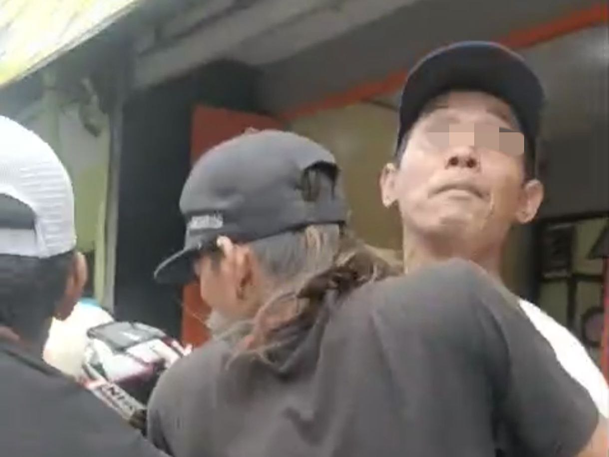 Tangkapan layar tukang parkir yang mengintimidasi penjaga usaha kuliner di Kota Malang, Jawa Timur.