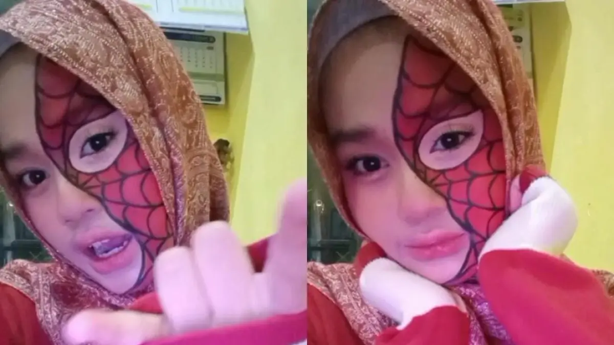 Spider-Man face art memadukan pola jaring laba-laba khas superhero dengan smokey eyes, glitter, dan rhinestones. (Janetta untuk Radar Banyuwangi)